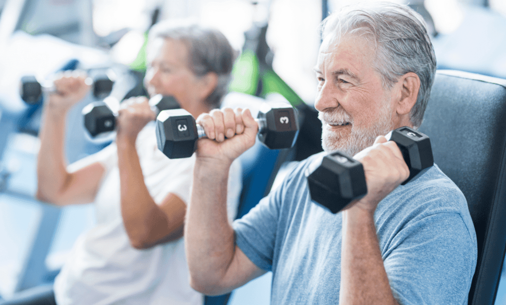 Seniors lifting dumbbells in a fitness center to protect against Alzheimer's