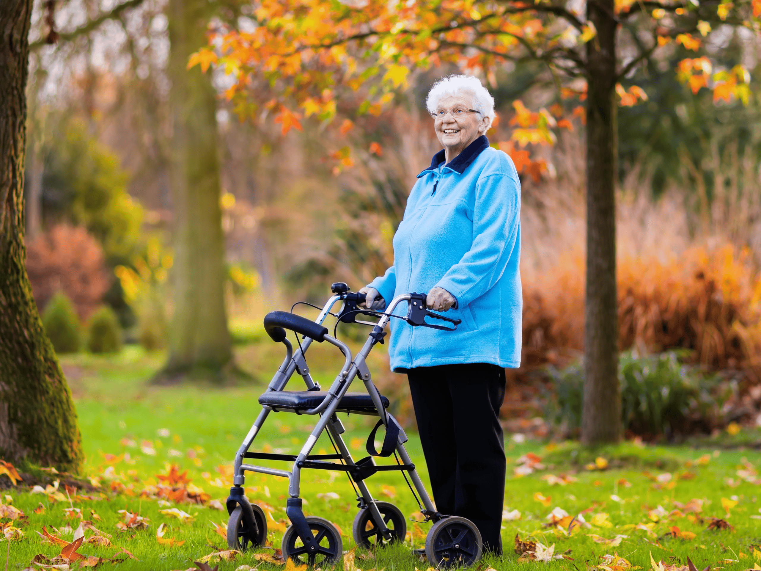 Senior using a falls prevention strategy while staying alert as she navigates uneven terrain with her walker