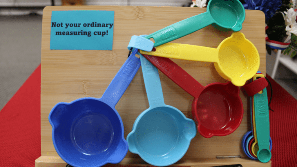 Color cups and spoons on display in the assistive technology center.